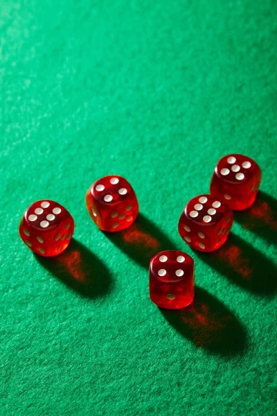 Live roulette wheel in professional studio with ball in motion and dealer presenting the outcome